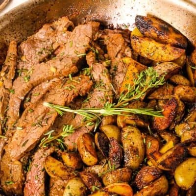 Skillet Steak and Potatoes in a saute pan with herbs