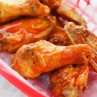 Baked Wings in a red basket lined with parchment