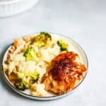 White plate with a serving of the chicken broccoli and rice casserole on the plate
