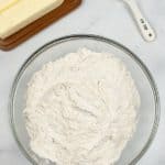 Crisco Pie Crust Ingredients, glass bowl with flour butter and measuring spoon