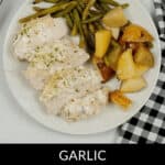 Plate with sliced white chicken, green beans, and roasted potatoes. Napkin on the side. Text: "Sheet Pan Chicken with Vegetables.
