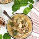 Top shot of Instant Pot Sausage and spinach soup with spinach and Instant pot in backgroup