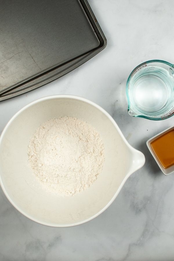 Measuring cup with pancake mix with flour and spices