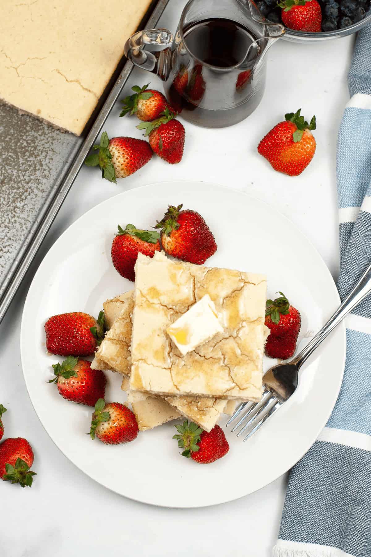 A top shot of the finished pancakes and fruit.