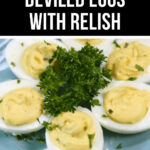 Platter of Deviled Eggs with Relish garnished with parsley on a blue plate.