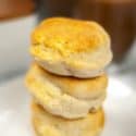 A stack of air fryer biscuits on a white plate.