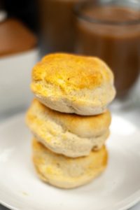 A stack of air fryer biscuits on a white plate.