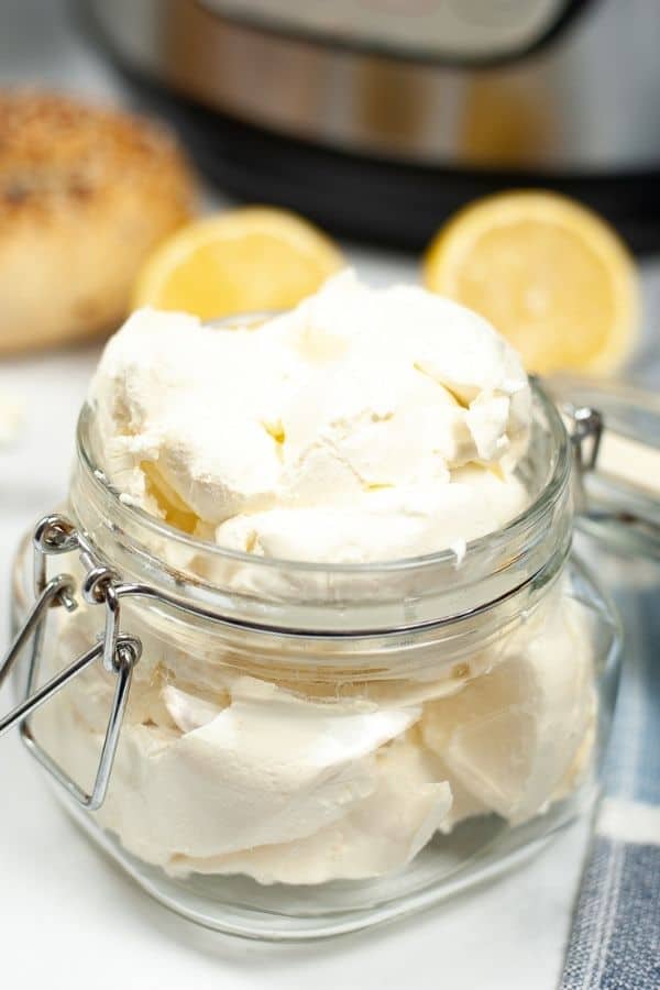 Instant Pot Cream Cheese in a Mason Jar with slices of lemon.