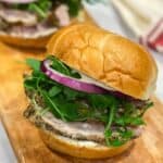 Porketta roast sandwich on a wooden board.