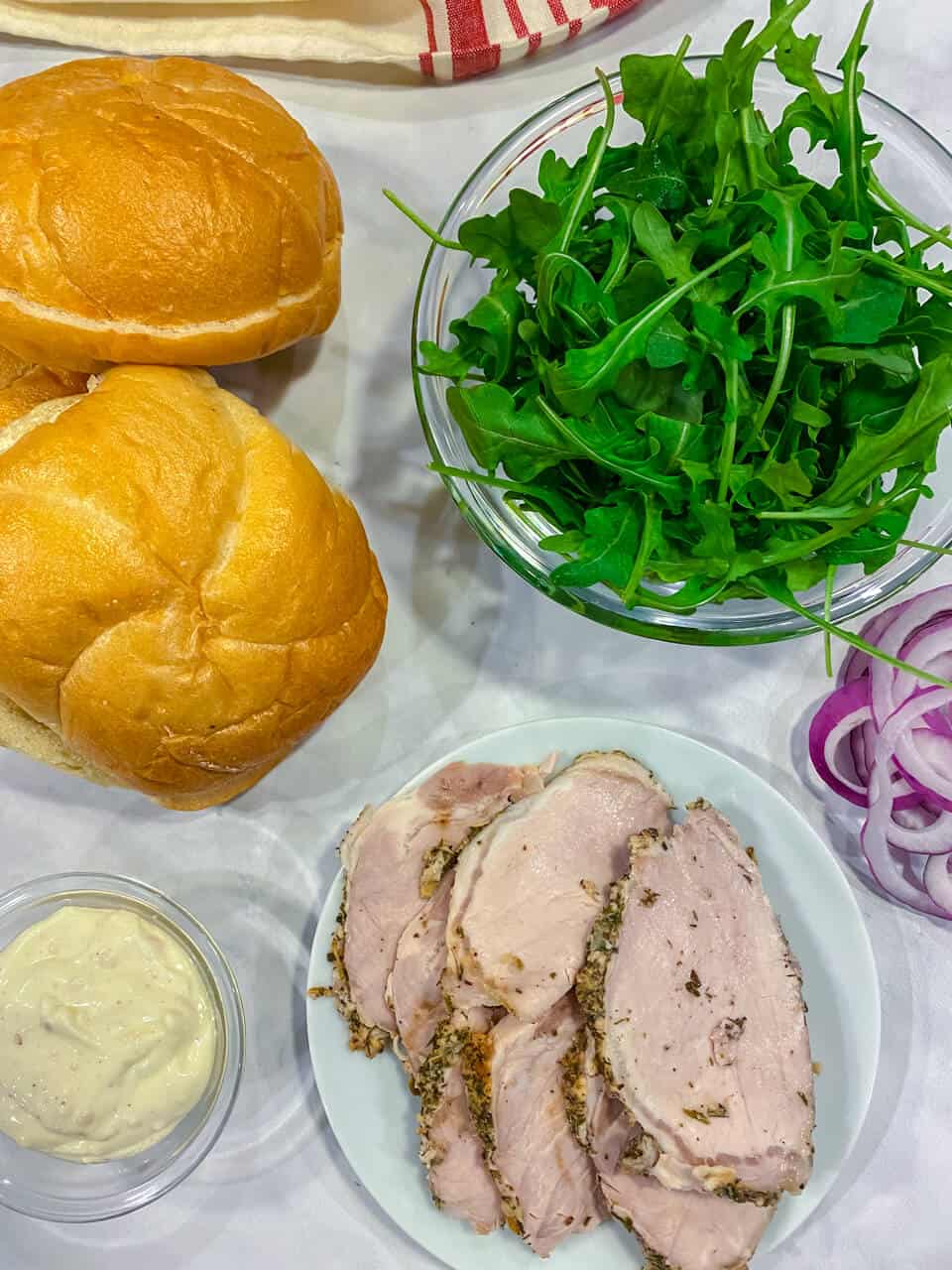 The meat, rolls and filling for the meal.