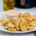 Side view of air fried pickles.