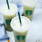 Top shot of 3 matcha lattes with green straws.