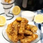 Air Fryer Fish Sticks on a clear glass plate.