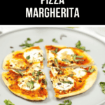 A Pizza Margherita, sliced into pieces on a gray plate, is topped with fresh basil and creamy mozzarella. The label "Air Fryer Pizza Margherita" crowns this delicious creation.