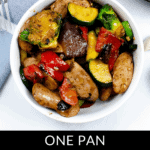 A bowl of chicken apple sausage skillet brimming with vegetables like zucchini, peppers, and Brussels sprouts sits enticingly. A fork and napkin are nearby. Text at the bottom reads "One Pan Chicken Apple Sausage Skillet Recipe.