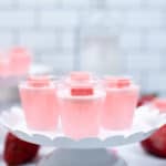 Side view of strawberry Jello Shots with Starbursts.