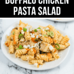 Plate of creamy buffalo chicken pasta salad featuring rotini pasta, diced chicken, crumbled blue cheese, and chopped green onions. Text overlay reads "Creamy Buffalo Chicken Pasta Salad—the ultimate chicken pasta salad.