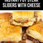 Steak sliders with cheese grace the plate, showcasing soft buns brimming with a tantalizing steak slider meat and cheese filling.