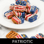 A plate of patriotic pretzels, beautifully covered with red, white, and blue chocolate and adorned with star decorations.