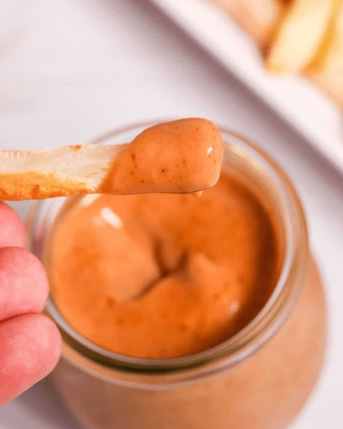 A fry dipped in the campfire mayo condiment.