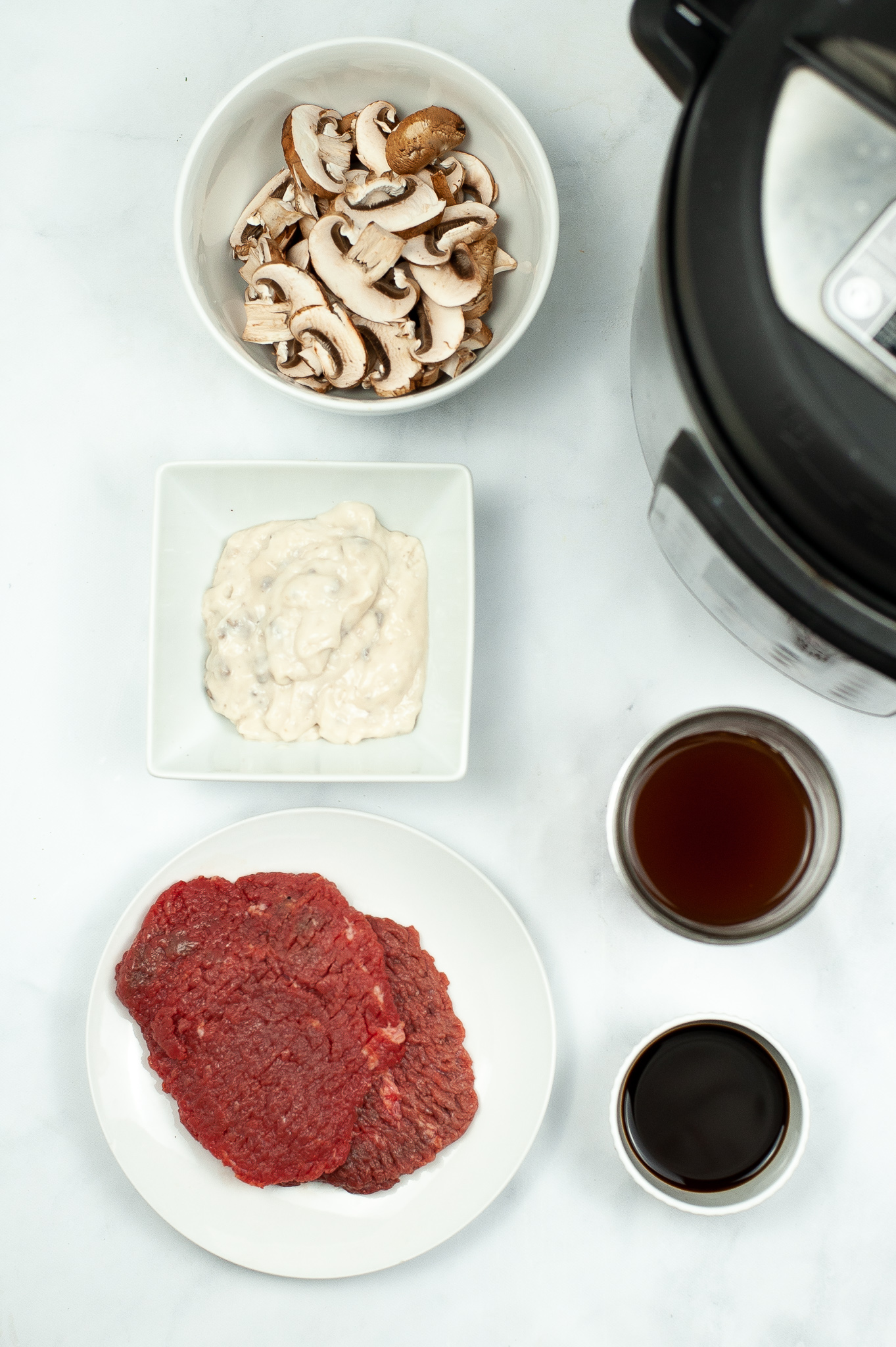 Plate with Cube Steak, Onions, mushrooms and seasonings.