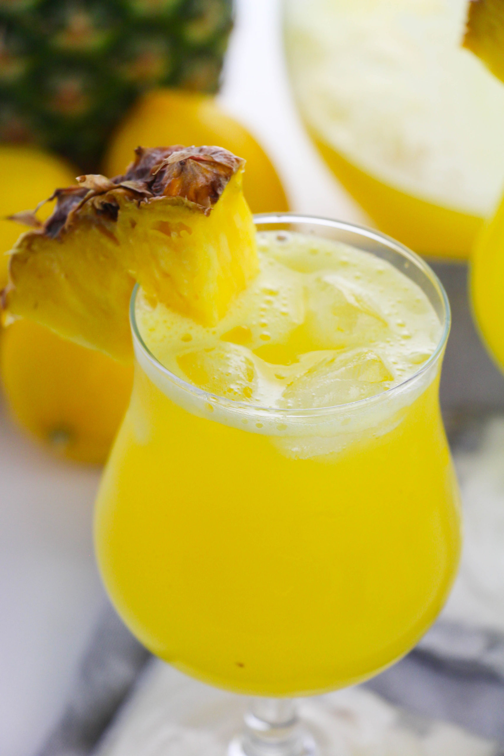 Pineapple lemonade in a clear glass.