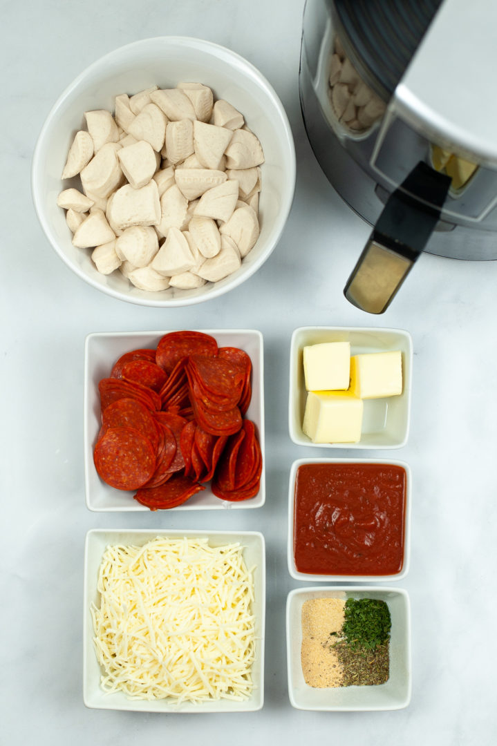 Cheese pepperoni, butter and ingredients needed to make pizza bread.