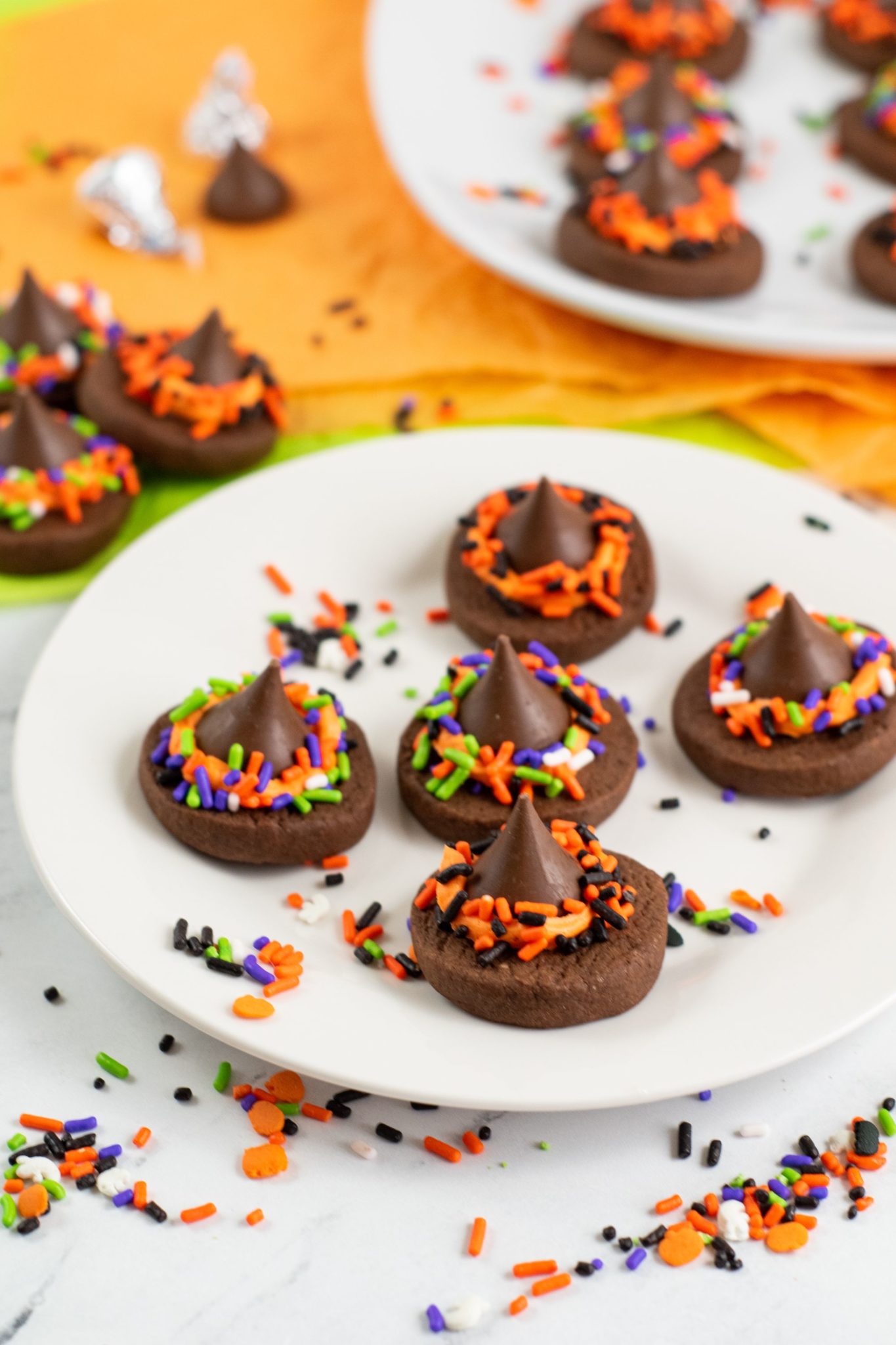White round plate with Witch Hat Cookies.