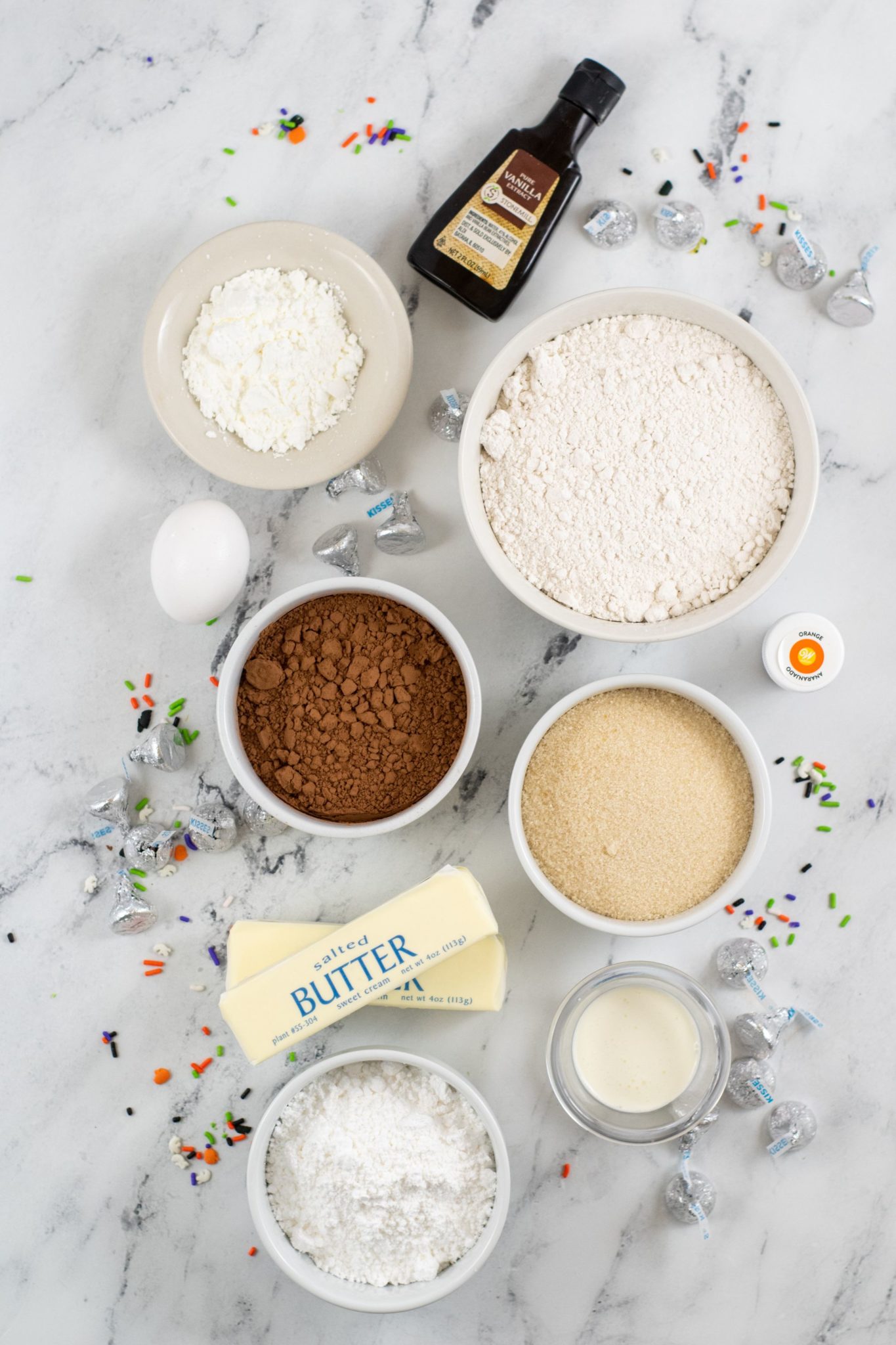 Cookie and decorating ingredients. Butter, vanilla, eggs, flour cocoa. etc