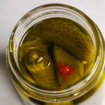 Moonshine Pickles in a jar from the top.