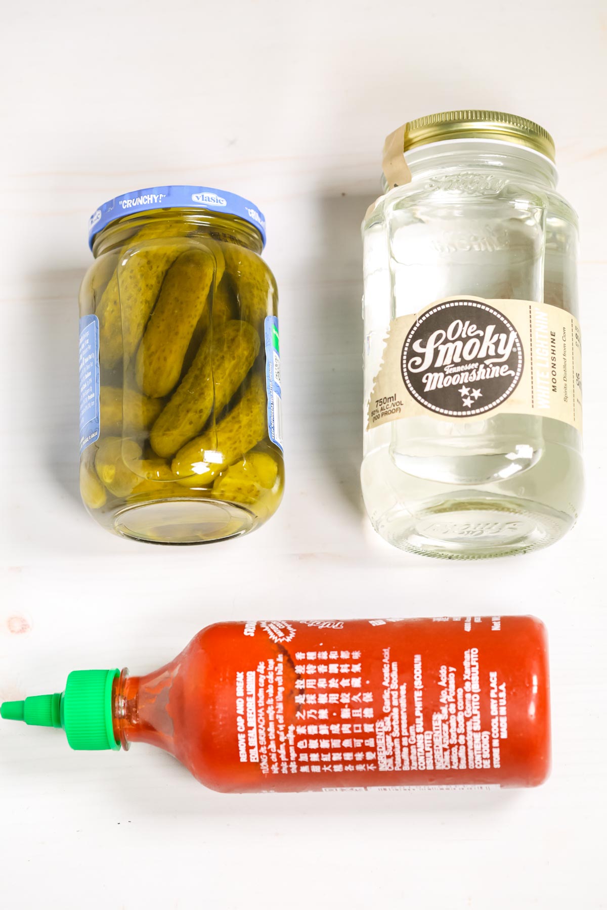 Jar of pickles, moonshine and sriracha.
