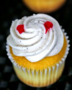 Vampire cupcake with white frosting.