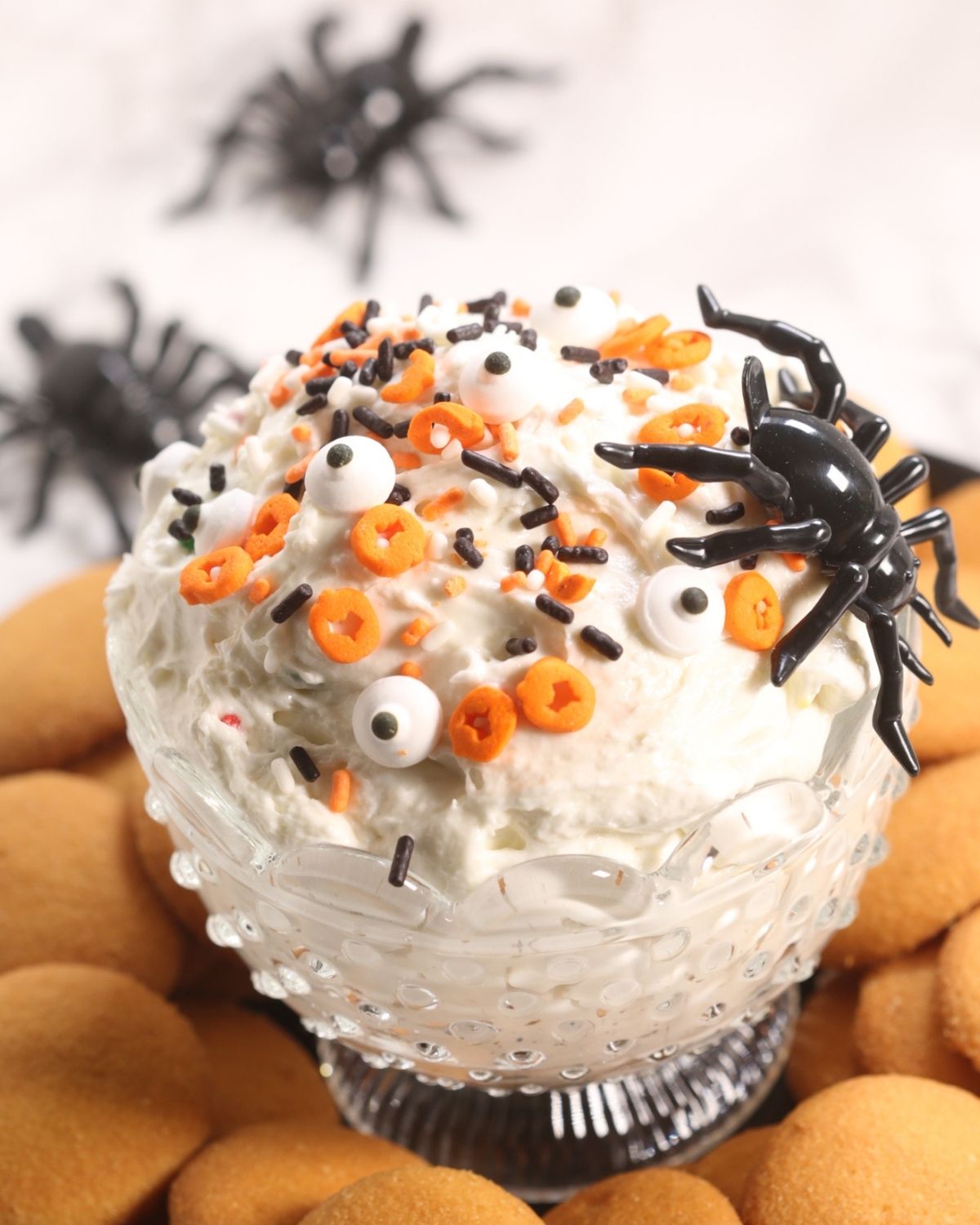 Halloween Cake Batter Dip surrounded by vanilla wafers
