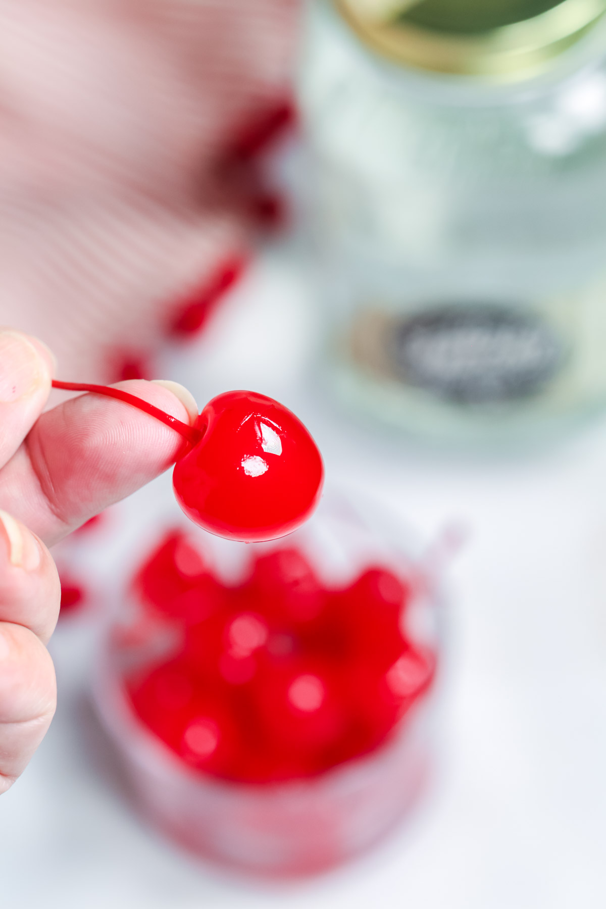 Moonshine Cherries with a close up on a single cherry.