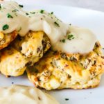 Cheddar and Sausage biscuits covered in white gravy.