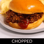 A chopped brisket sandwich with barbecue sauce on a bun, accompanied by crispy potato chips on a white plate. Text at the bottom reads "Chopped Brisket Sandwich.