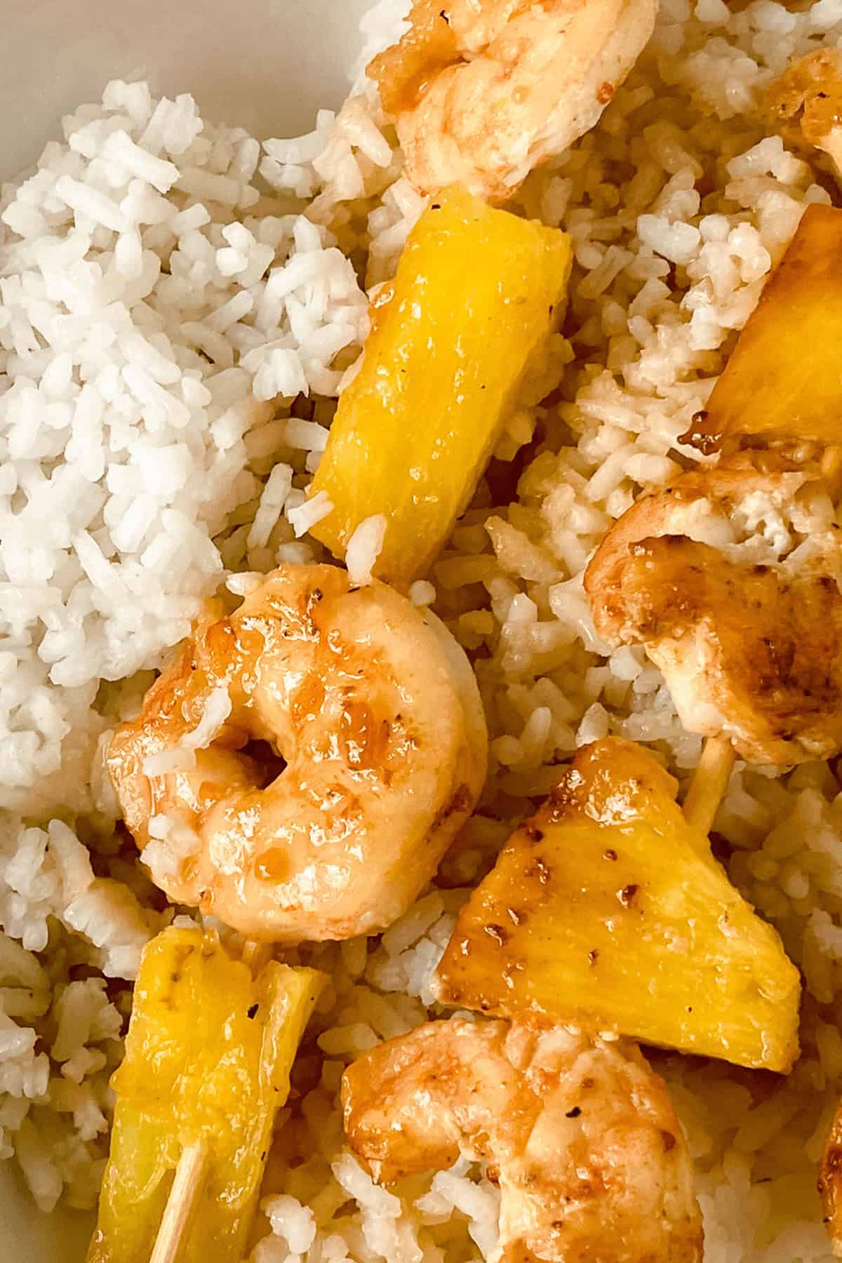 A plate of white rice topped with the finished dish.