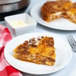 A plate with a slice of meal beside an instant pot.