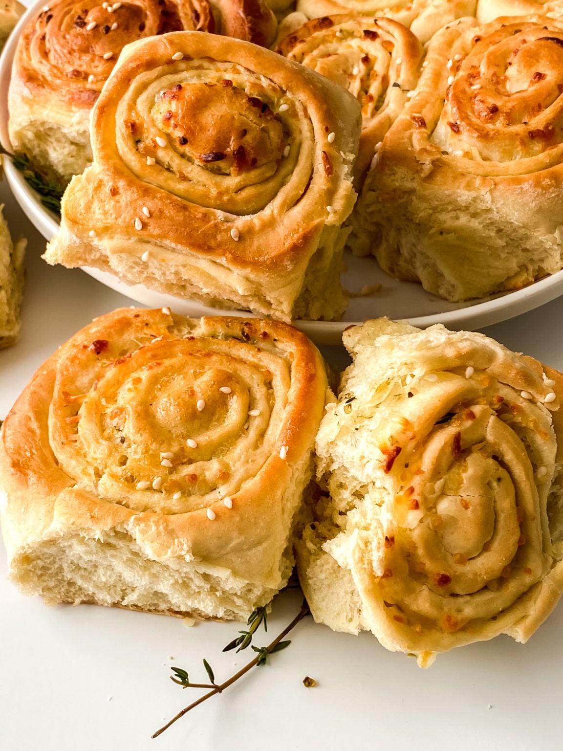 Mozzarella Thyme Pull Apart Pizza Bread stacked on a dish.