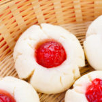 Cherry Shortbread Cookies on a round wicker dish.