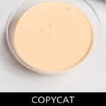 A clear bowl filled with a light orange creamy sauce, perfectly emulating the classic taste of an In n Out Sauce Recipe, labeled "Copycat In and Out Sauce.
