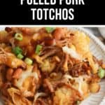 A plate of loaded pulled pork totchos topped with melted cheese, beans, barbecue sauce, and chopped green onions—this irresistible totchos recipe is perfect for sharing.