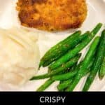 A plate featuring crispy baked breaded pork chops, accompanied by perfectly mashed potatoes and tender green beans. Text reads: "Crispy Baked Breaded Pork Chops.