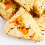 The bread laying on its side. with speckles of cheese on top.