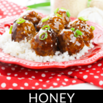 Glazed honey garlic meatballs served over rice on a red patterned plate, garnished with sesame seeds and green onions.