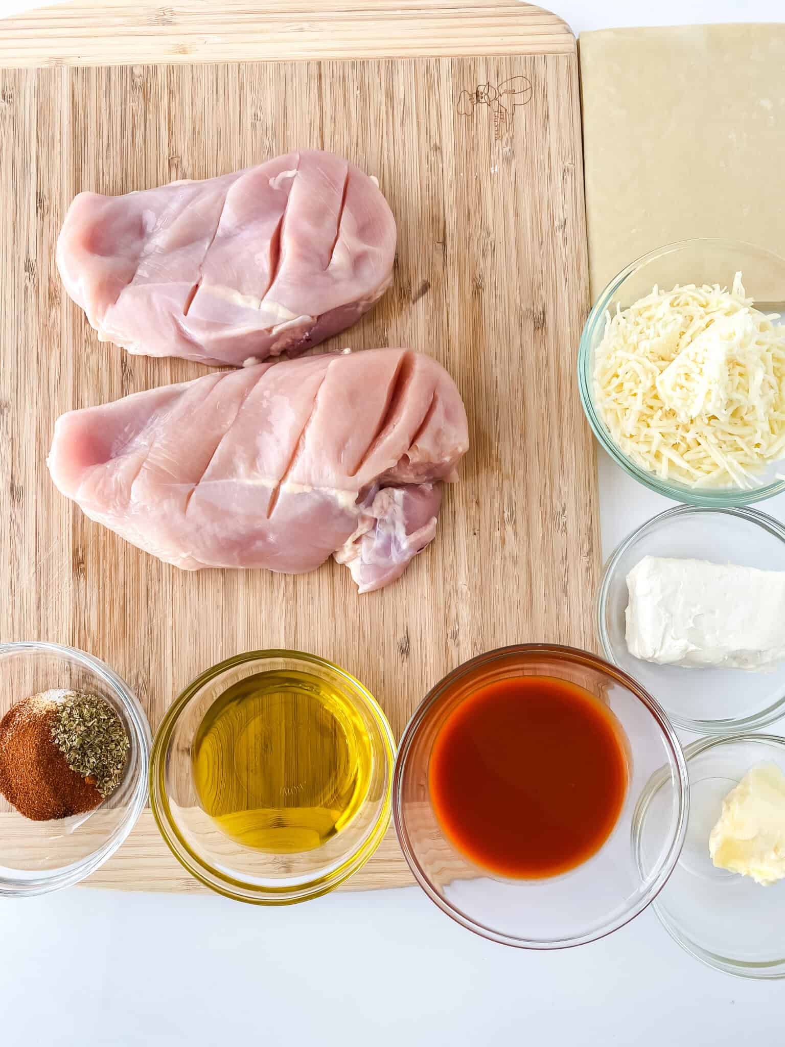 Buffalo chicken ingredients on a cutting board.