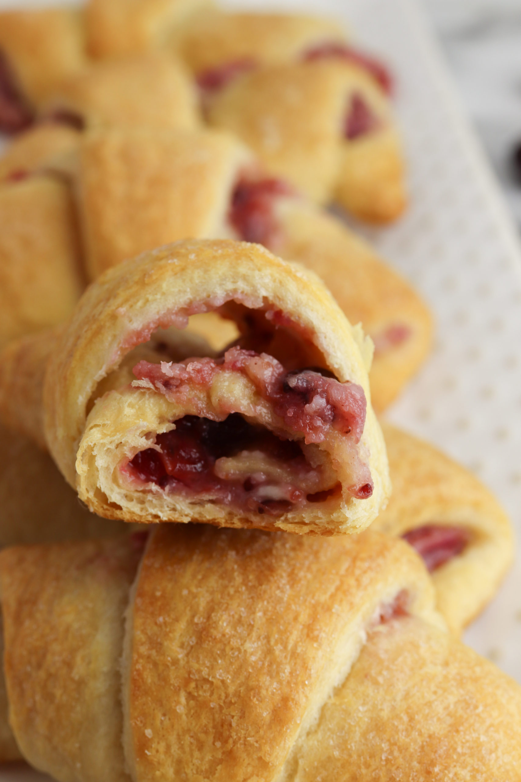 The inside of a cranberry cheesecake crescent roll