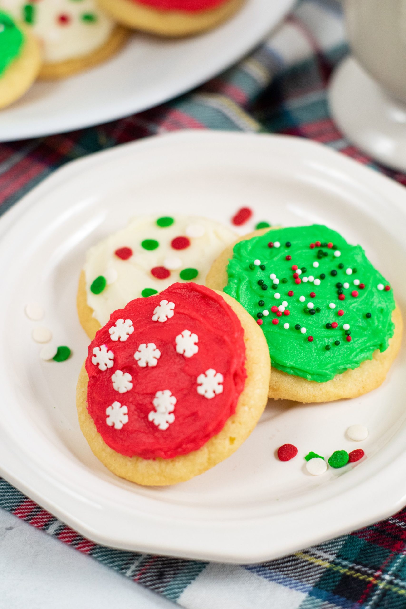 lofthouse cookies on a white plate with sprinkles