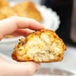 A hand holding a roll.