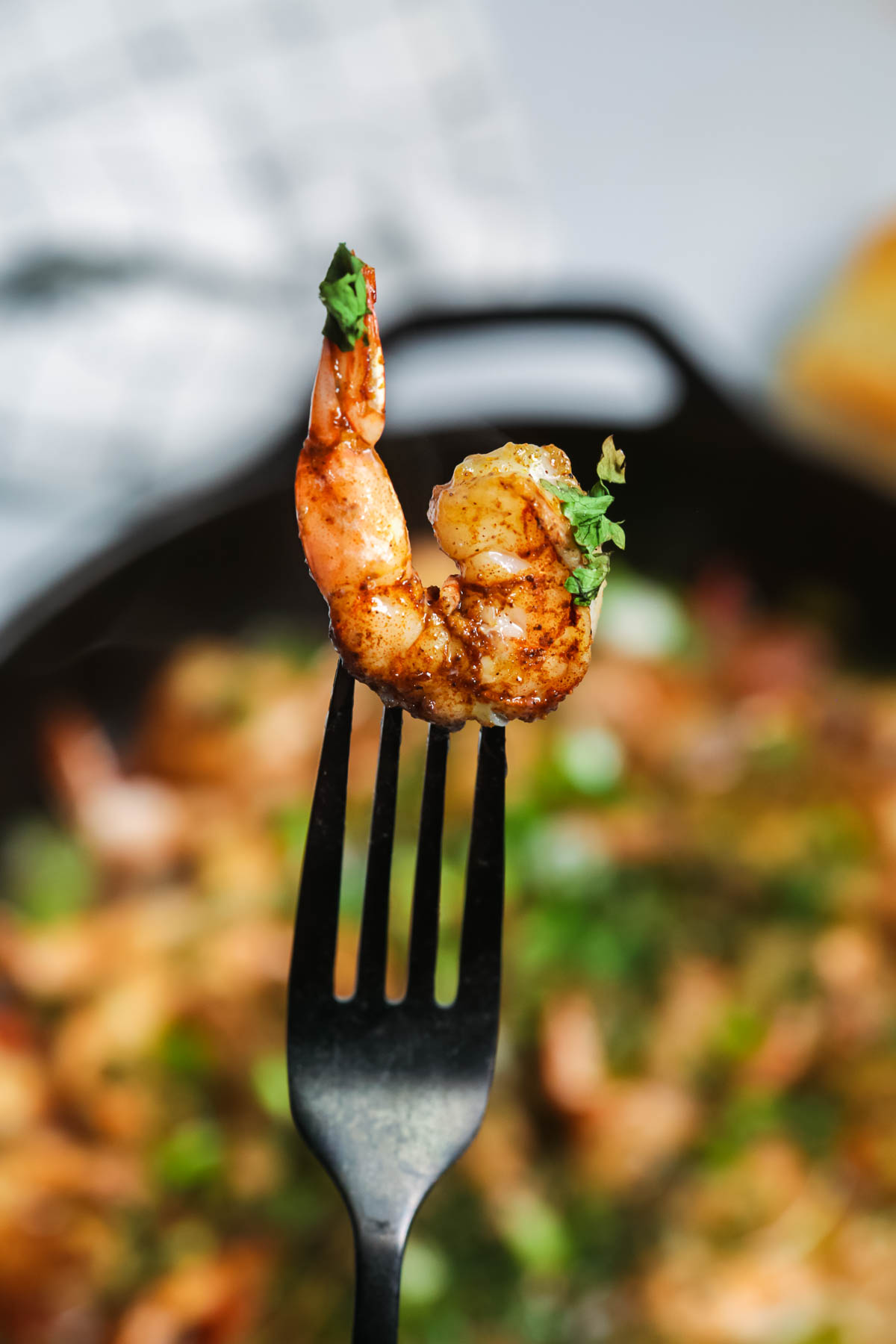 Caribbean Jerked Shrimp on a fork.
